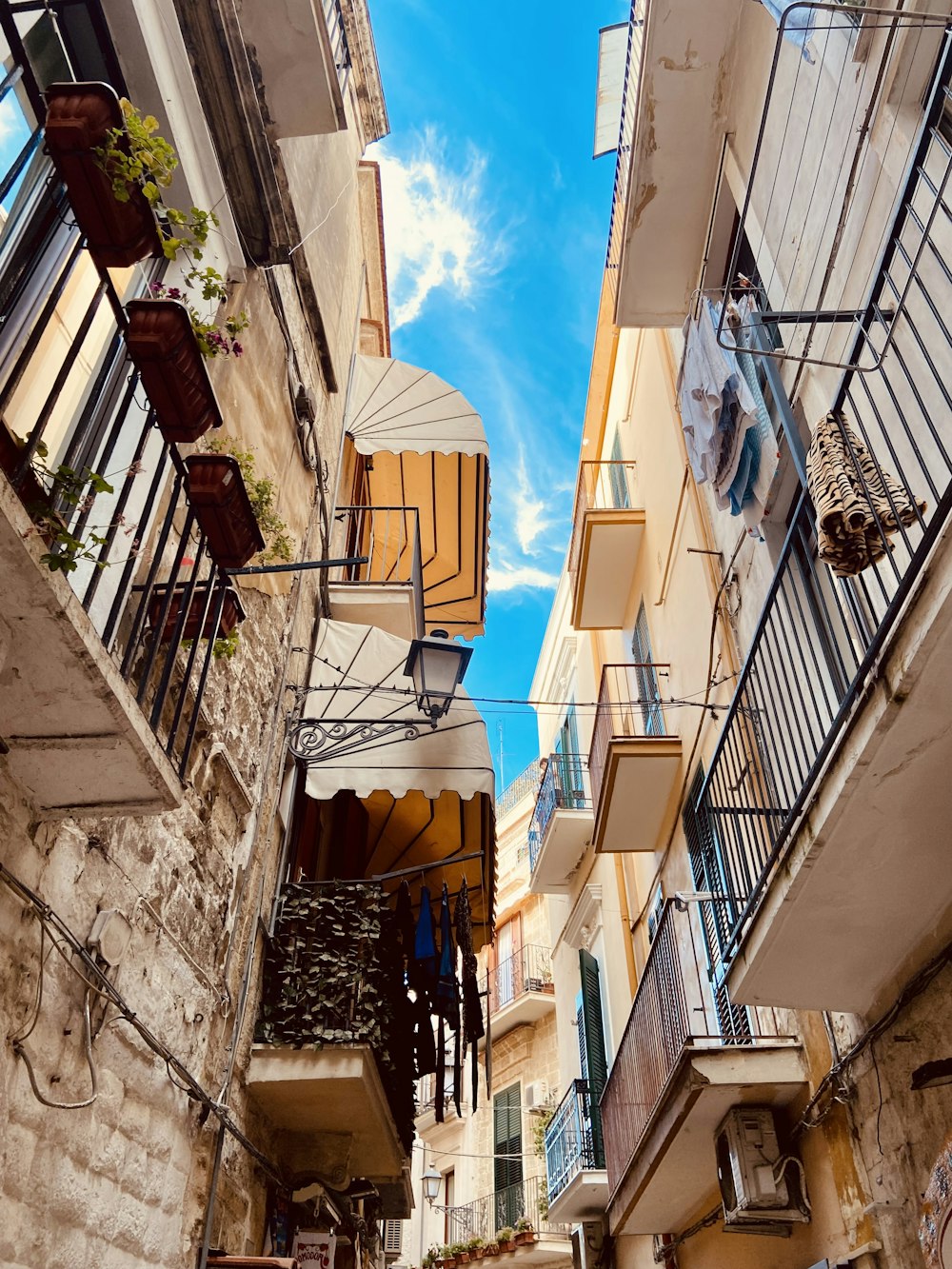 a narrow alleyway with balconies and balconies