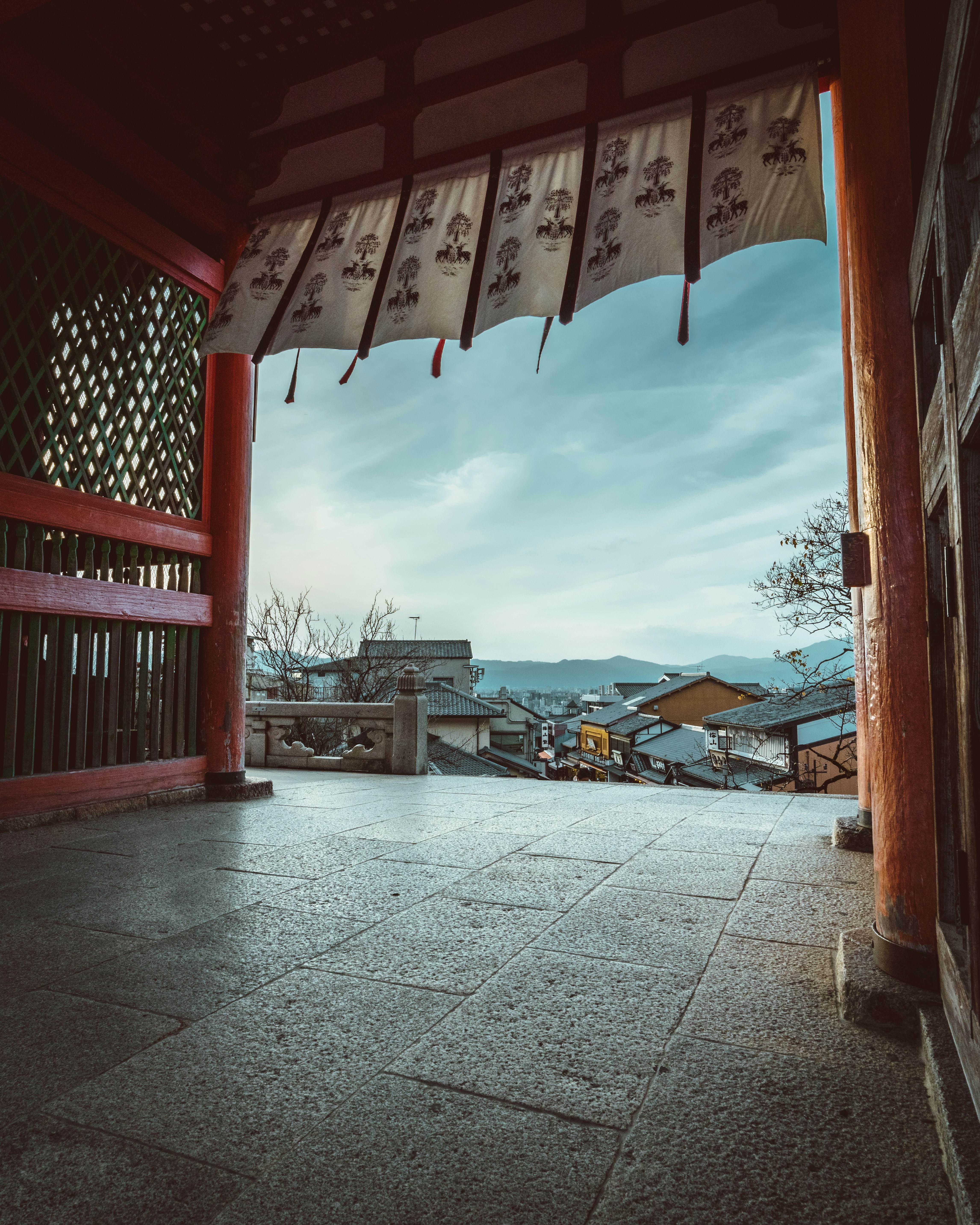 an open doorway with a view of a city