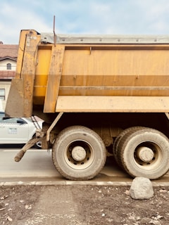 a dump truck parked on the side of the road