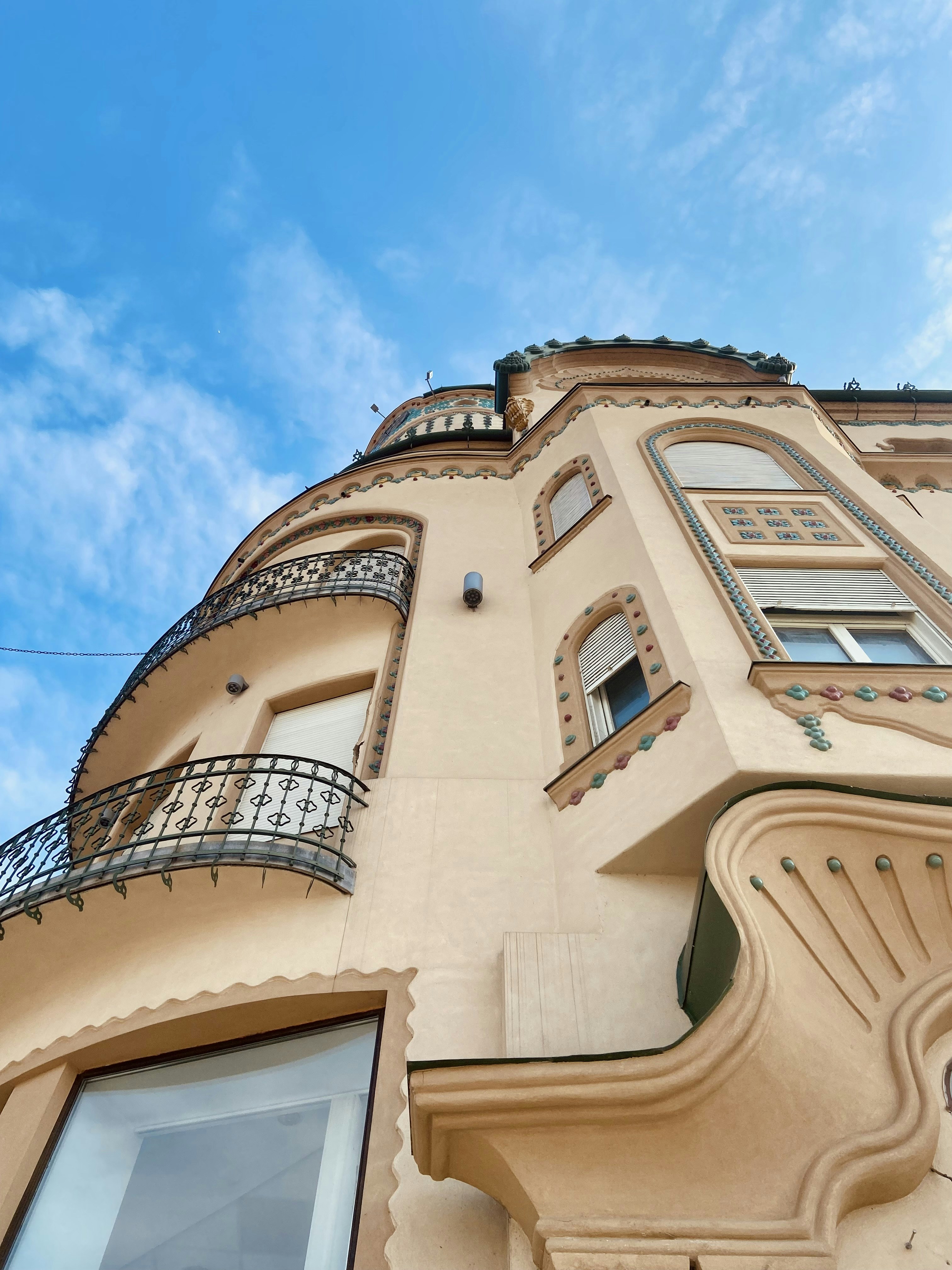 a tall building with a balcony and balconies
