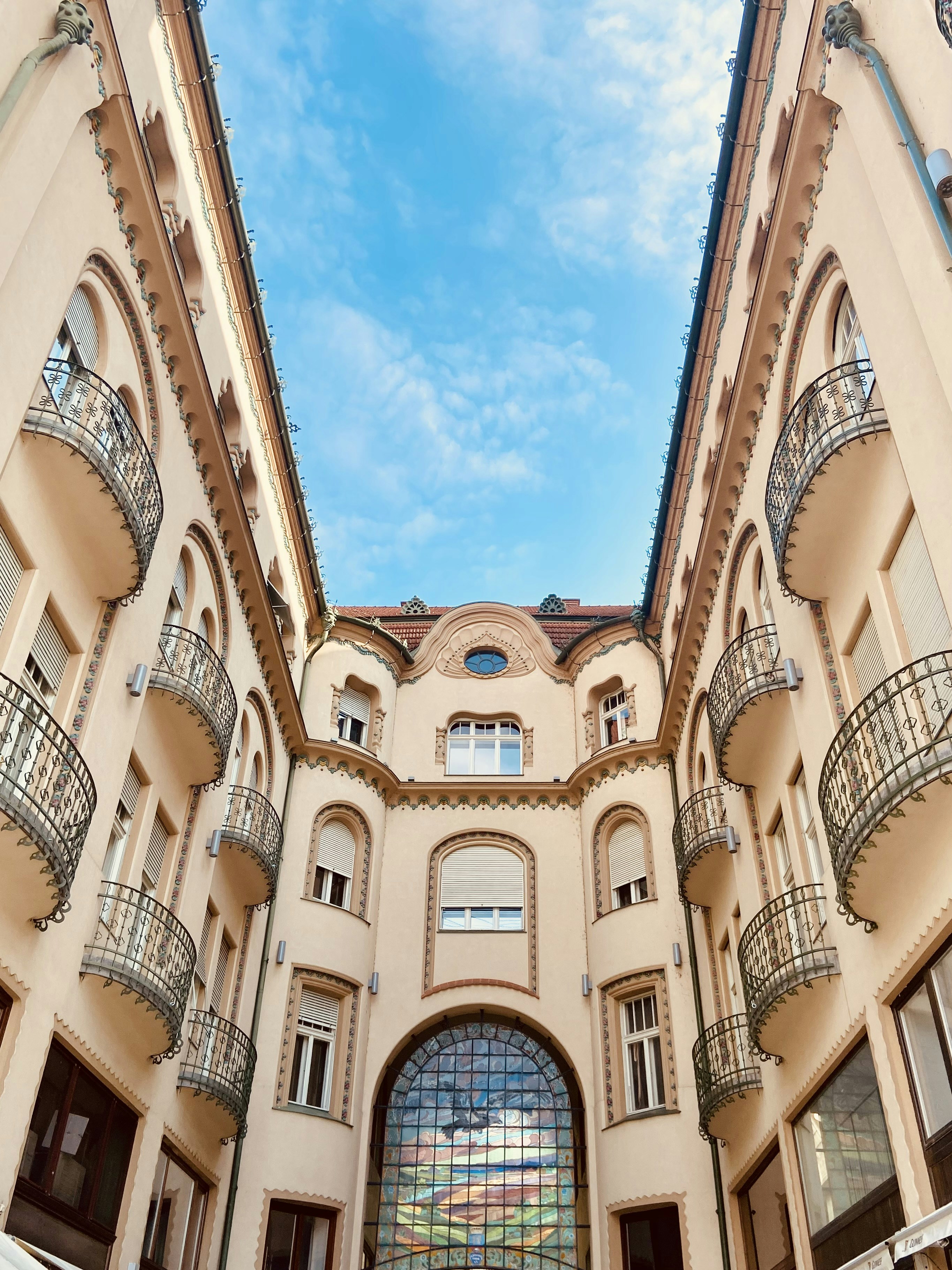 a very tall building with lots of windows and balconies
