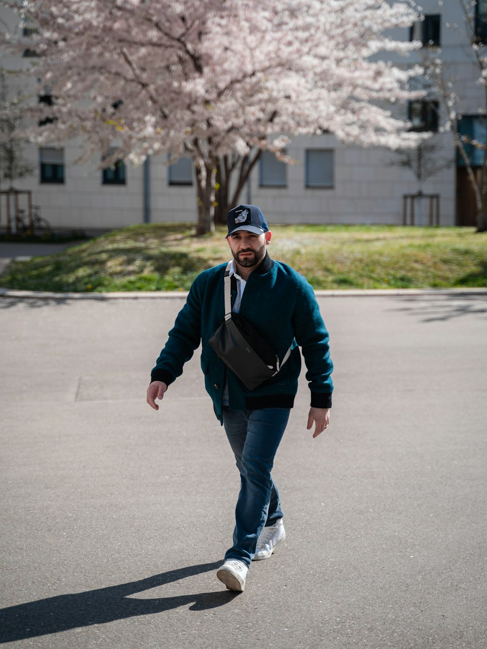 a man walking down a street with a backpack on his back