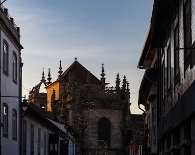 a church tower towering over a city street