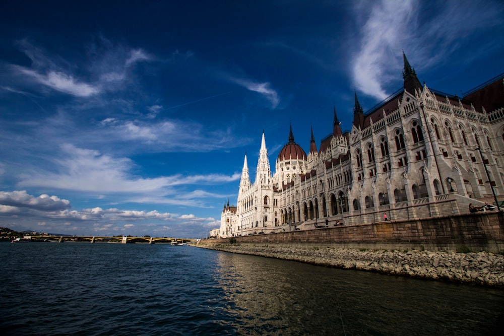 a large building sitting next to a body of water