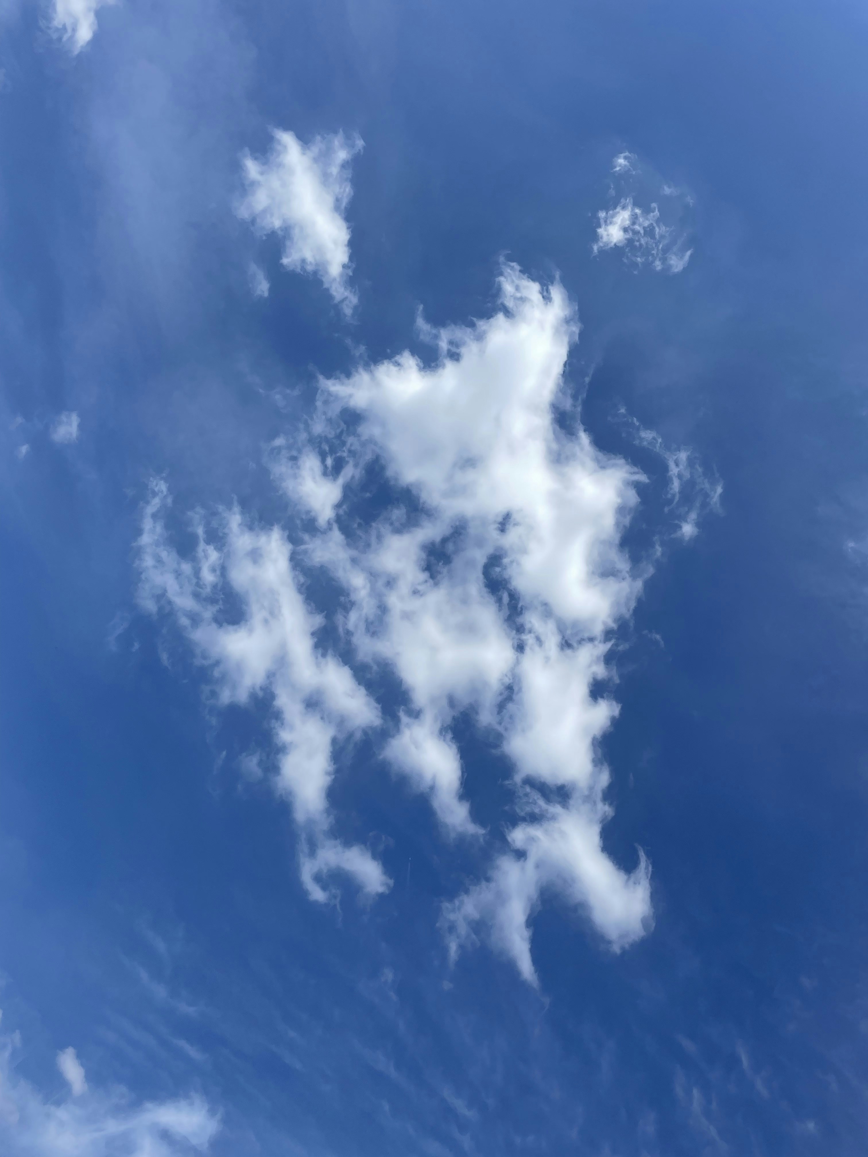 a plane flying in the sky with a lot of clouds