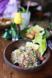 a bowl of food on a wooden table