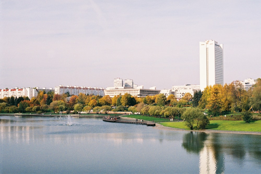 a body of water with a city in the background