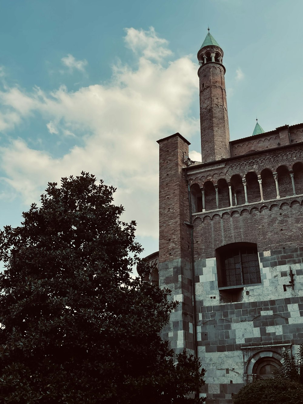 a tall brick building with a clock tower