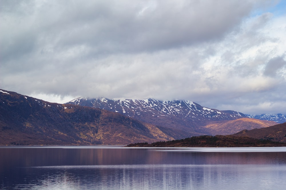 a large body of water surrounded by mountains