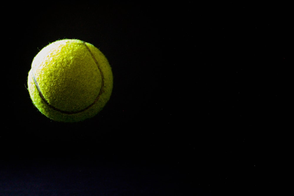 a tennis ball is flying through the air