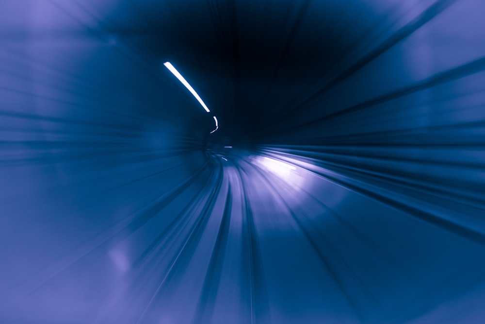 a blurry photo of a tunnel with a light at the end