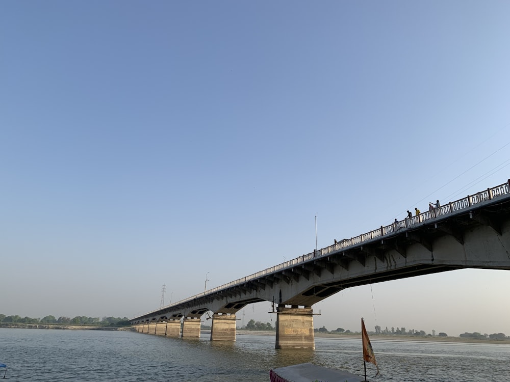 a bridge over a body of water with people on it