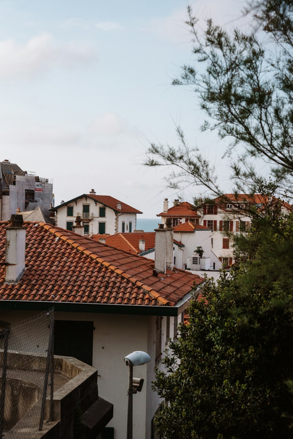 a view of a rooftop with a few buildings in the background