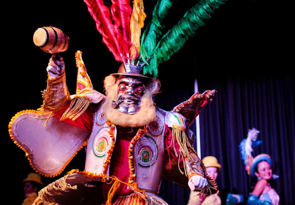 a group of people in costume on a stage