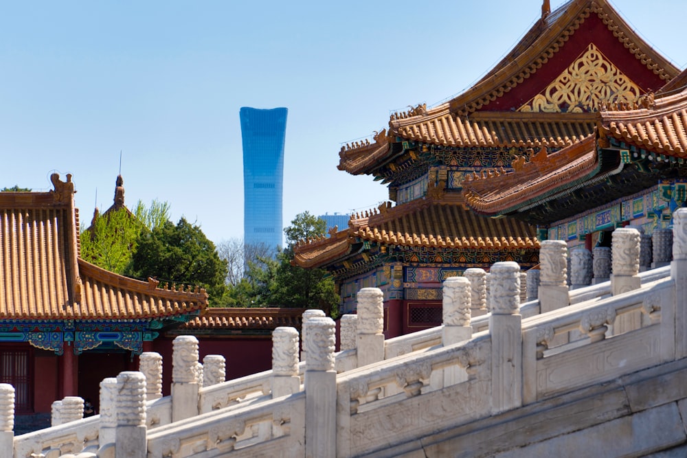 a view of a building with a tall blue cone in the background