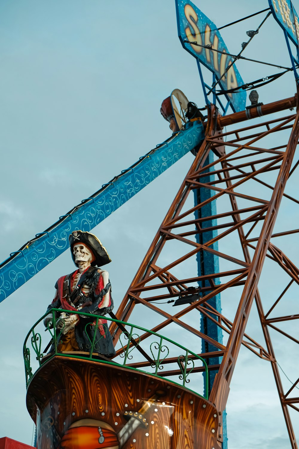 a statue of a pirate on top of a carnival ride