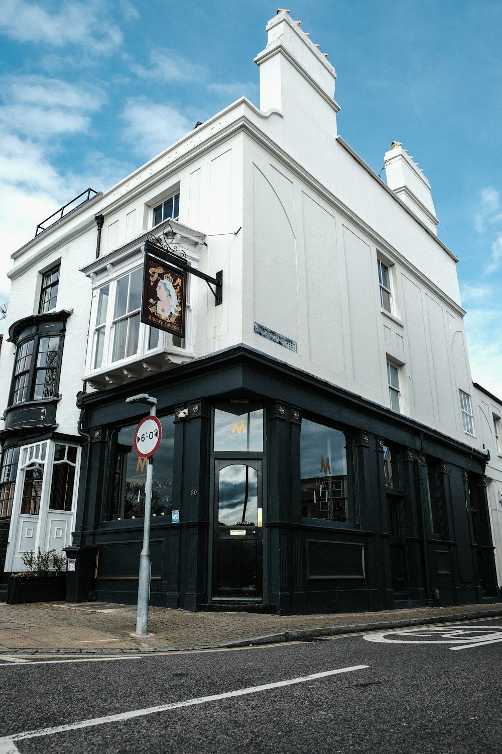 a white building with a clock on the front of it