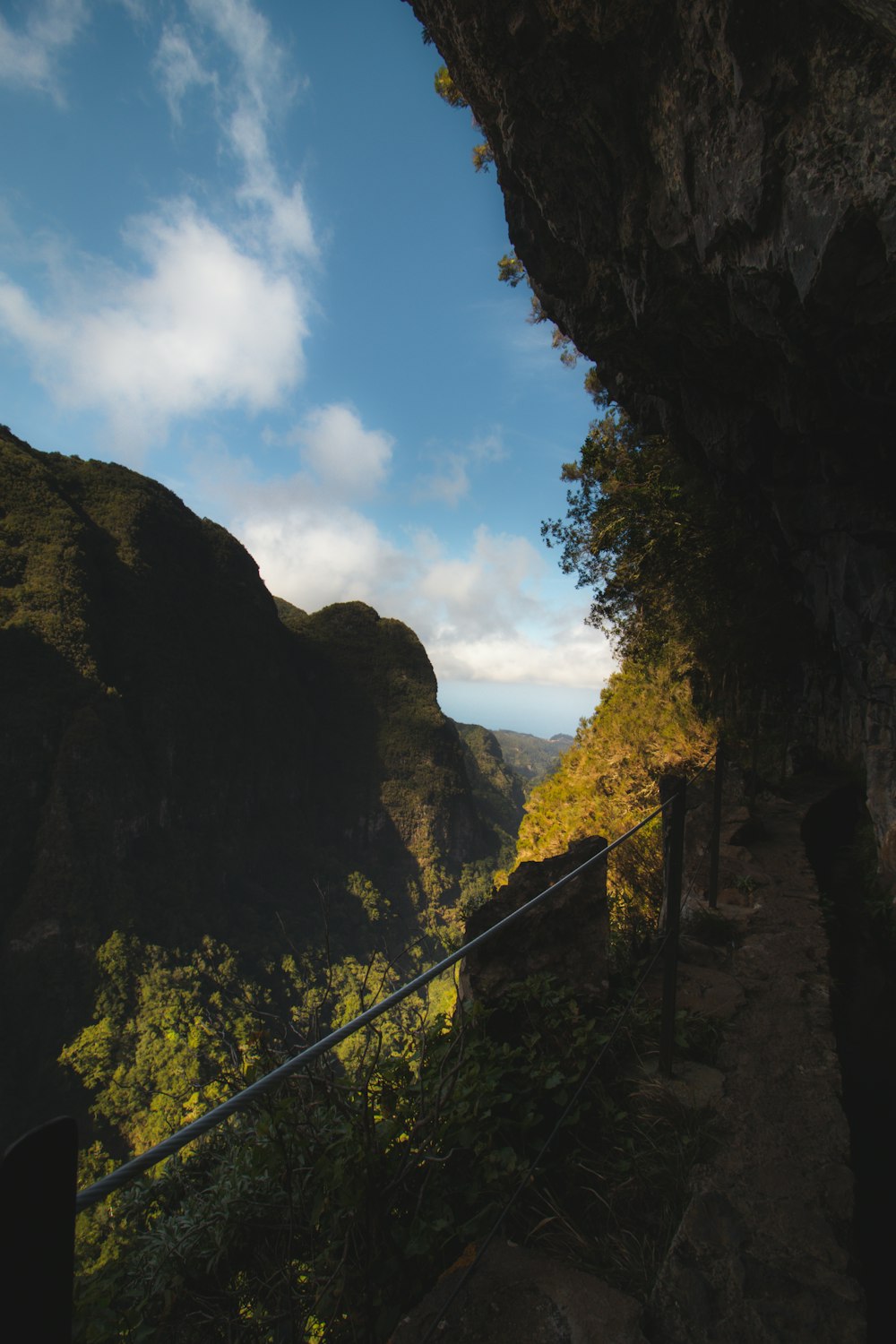 a view of the mountains from inside a cave