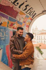 a couple of men standing next to each other