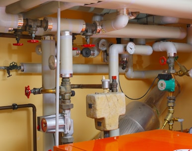 pipes and valves in a room with orange table