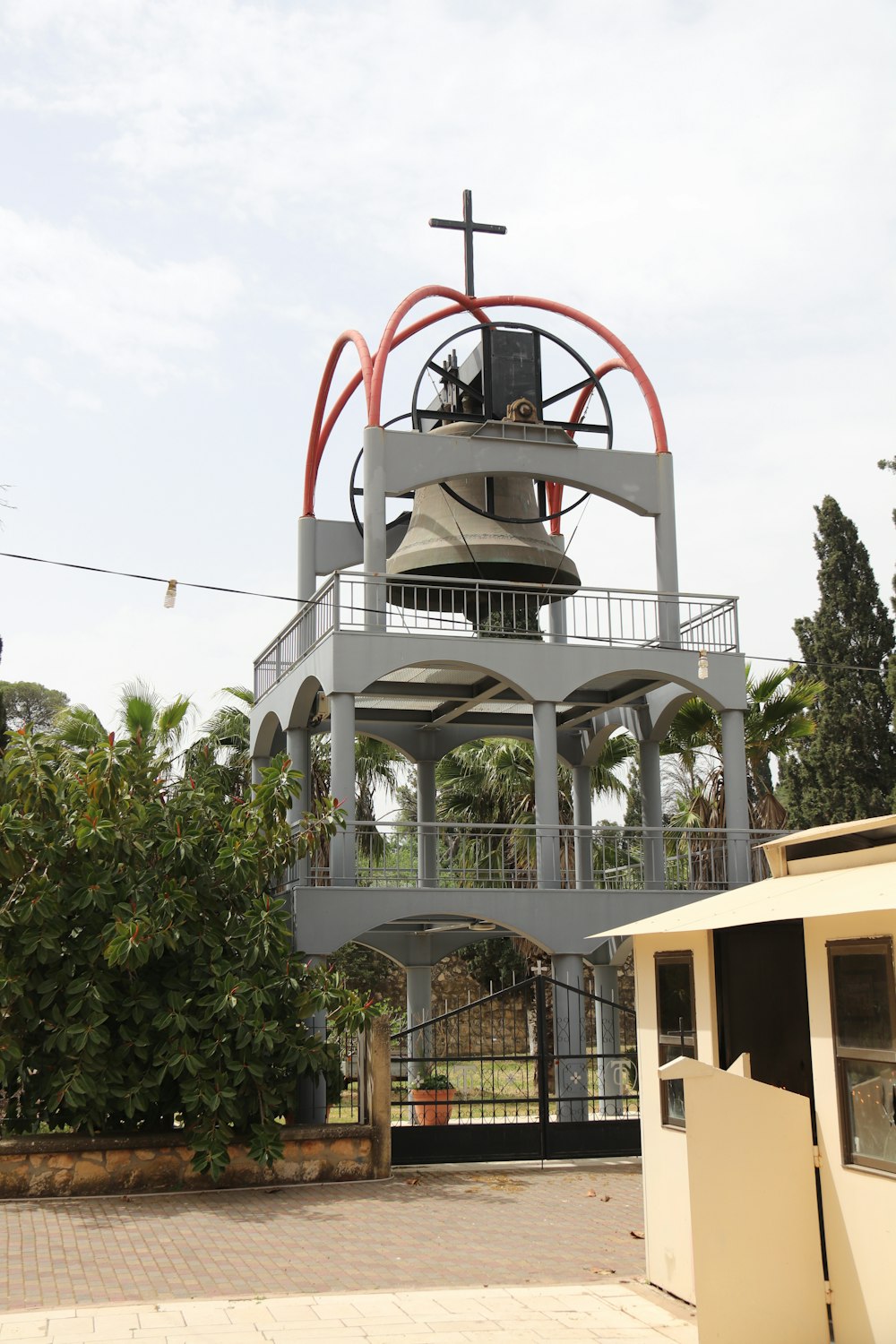 a bell tower with a cross on top of it