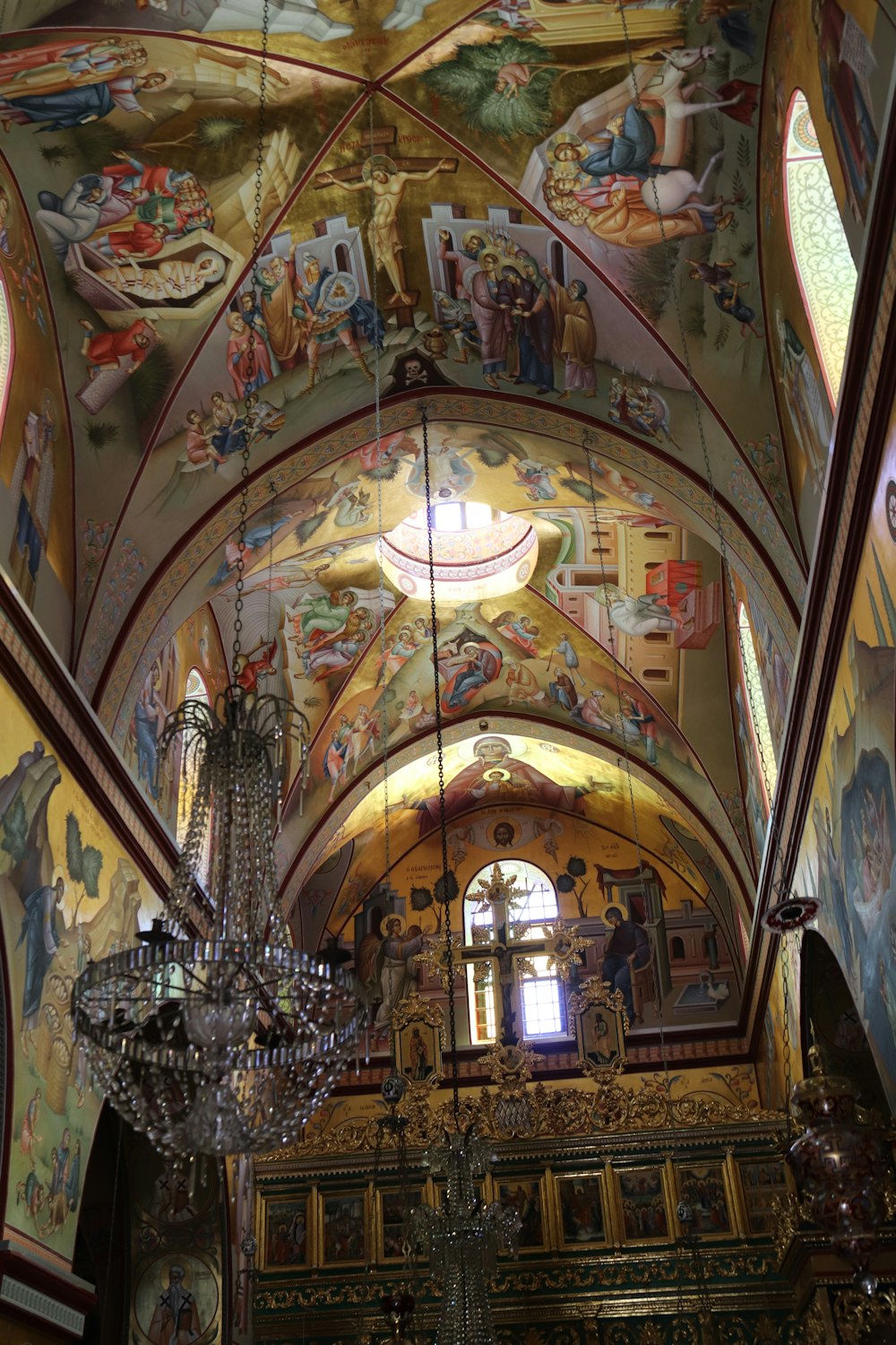 a church with a chandelier hanging from the ceiling