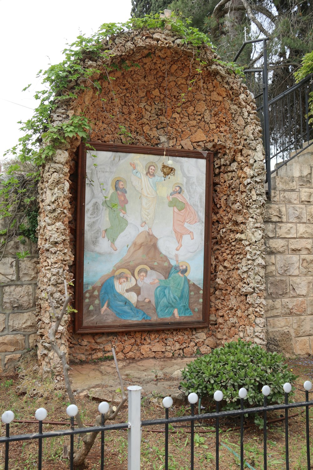 a painting on a stone wall of a nativity scene