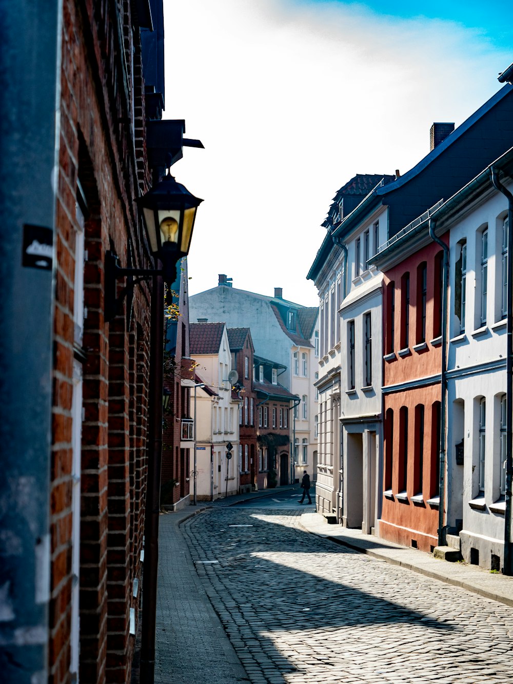 a cobblestone street in a small town