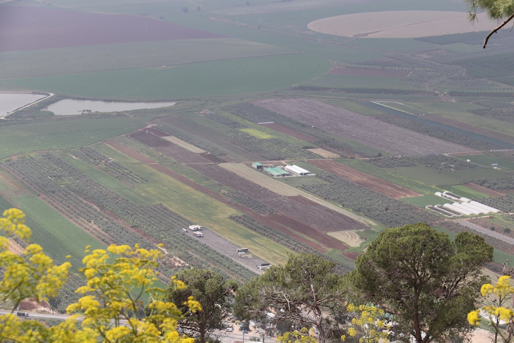 a view of a farm land from a hill