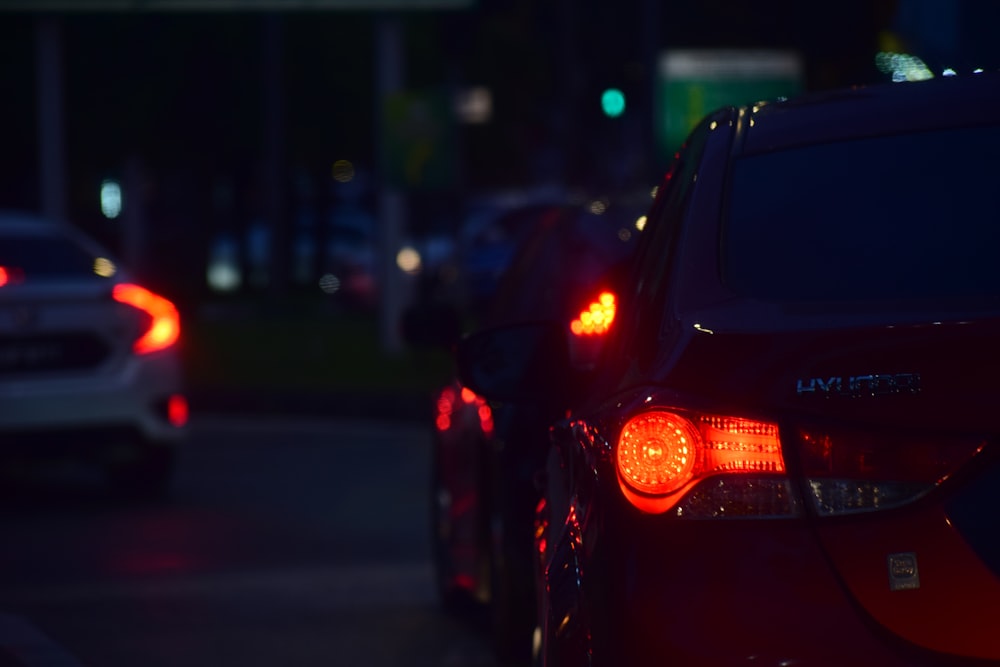 a couple of cars that are sitting in the street