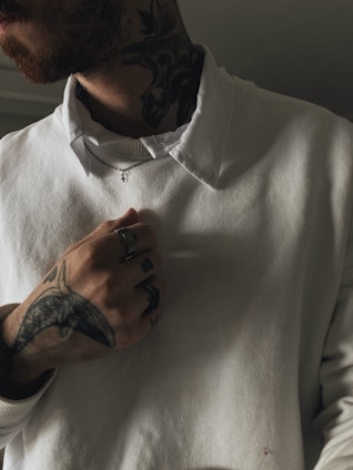 a man with a tattoo on his arm