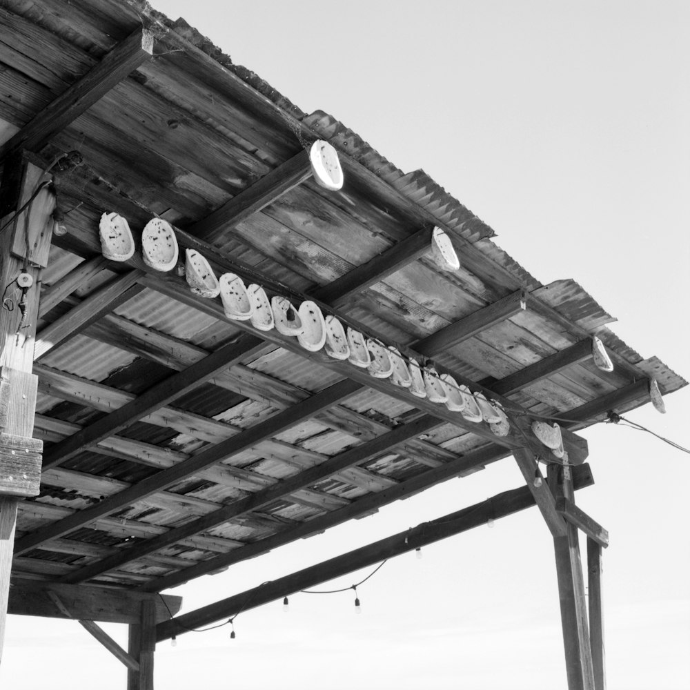 a row of clocks hanging from the side of a building