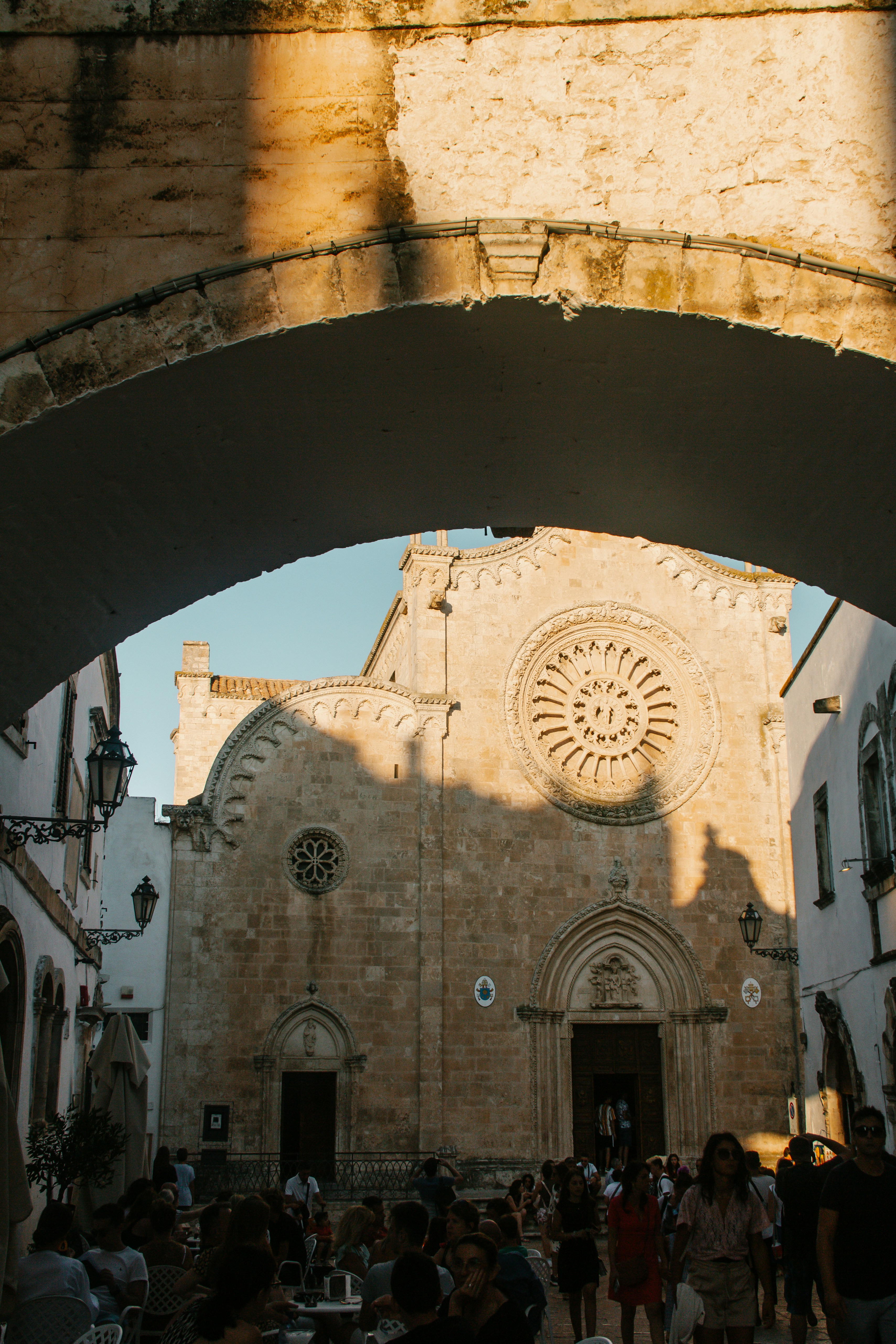 a group of people standing in front of a church