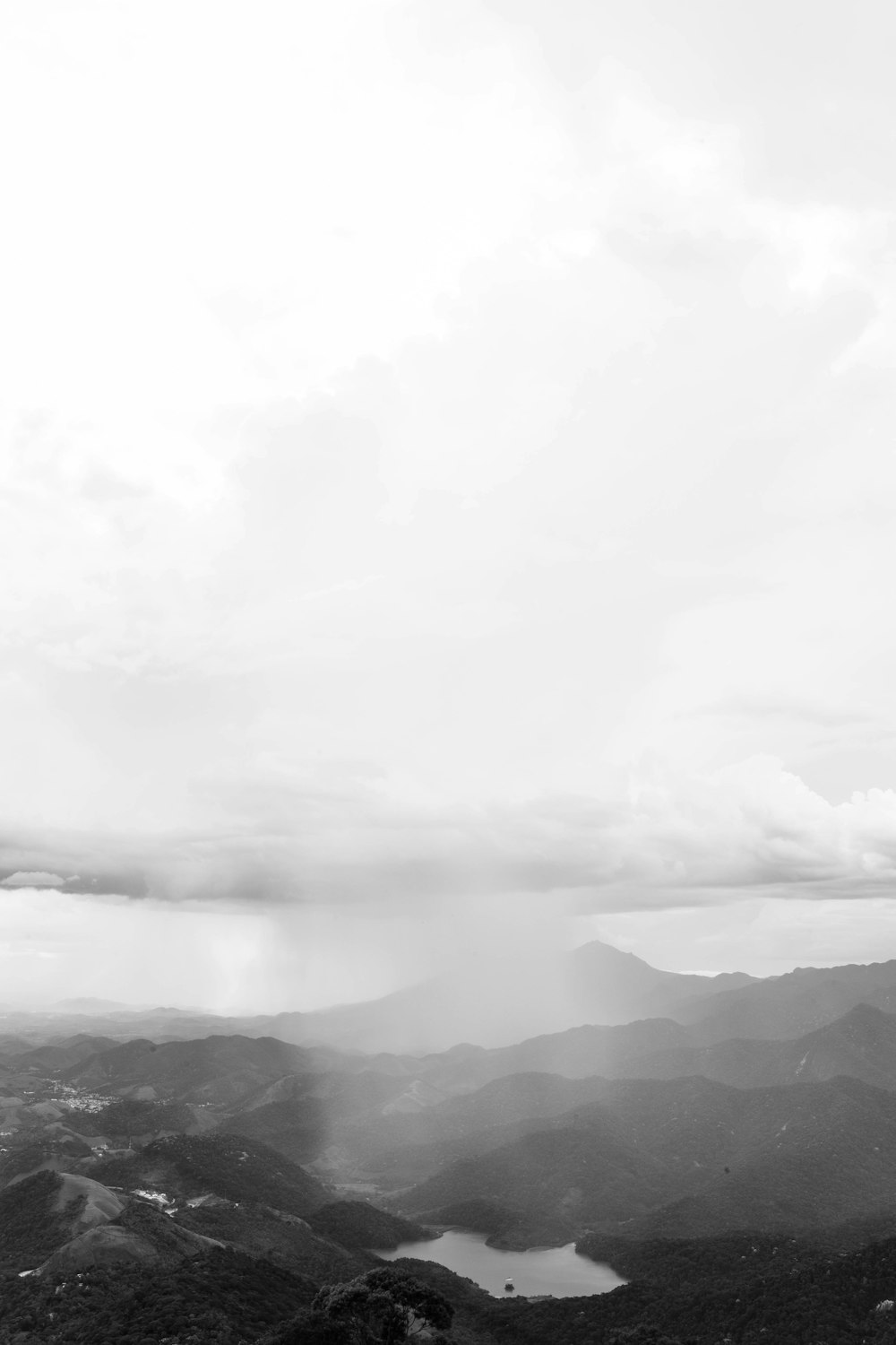 a black and white photo of a mountain range