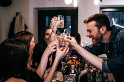 A group of happy restaurant staff celebrating a successful service.