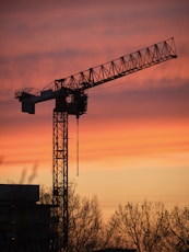 Tees Transporter Bridge over a body of water with a sunset in the background