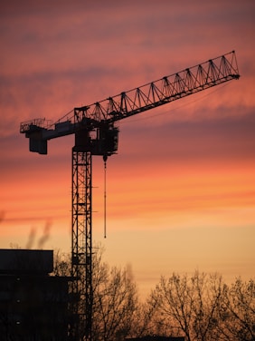 Tees Transporter Bridge over a body of water with a sunset in the background