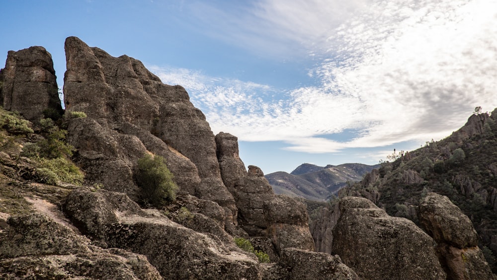 a view of a rocky mountain with a sky background