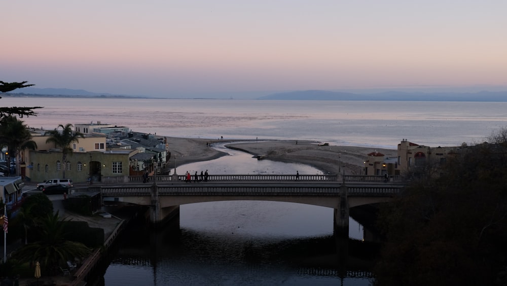 a bridge over a body of water at dusk