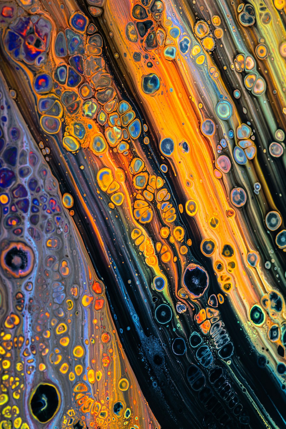 a close up of a colorful liquid filled with bubbles