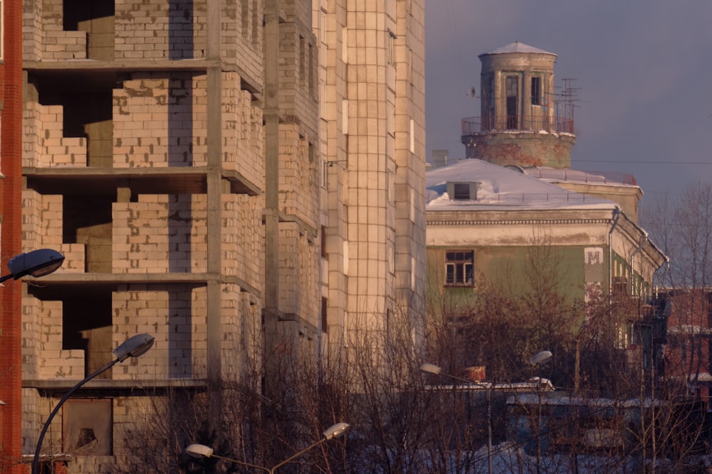 a tall building with a clock tower in the background