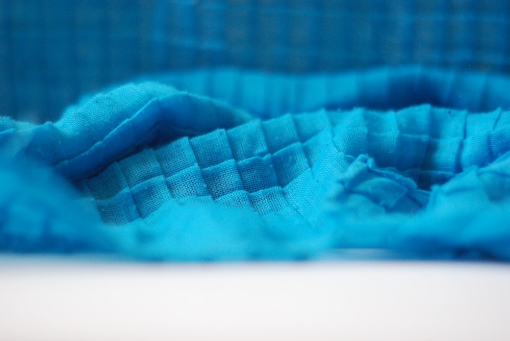 a close up of a blue cloth on a table