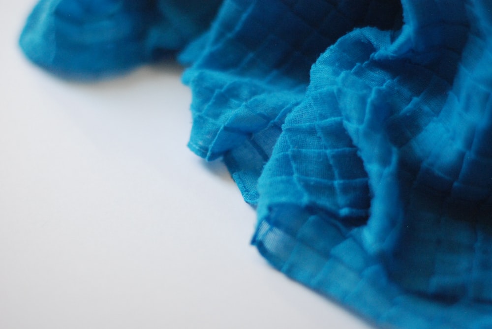 a close up of a blue cloth on a table