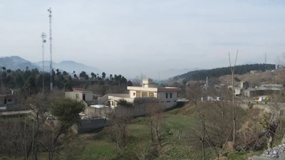 Rural landscape with internet tower providing coverage to farms and homes.