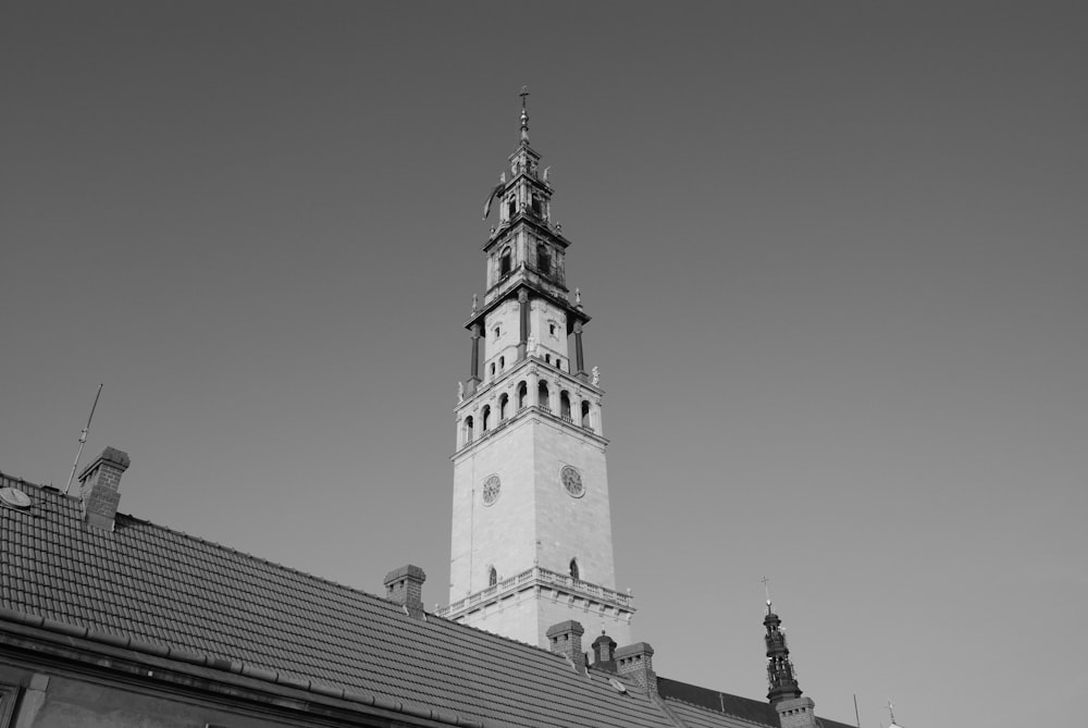 a black and white photo of a clock tower