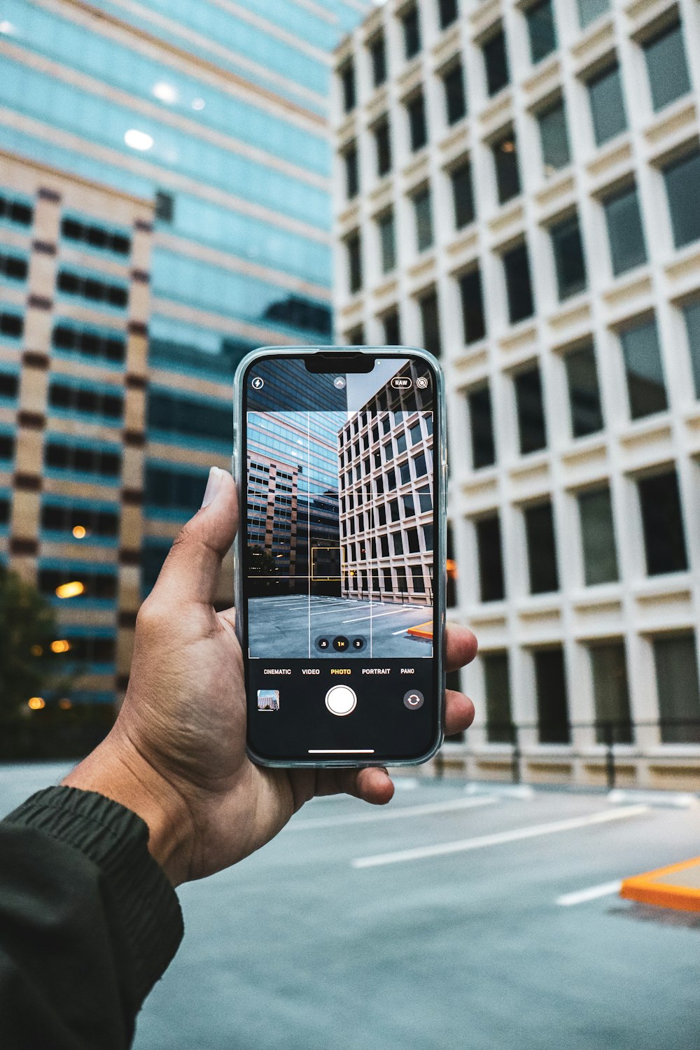 a person taking a picture of a building with their cell phone