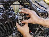 a person holding a car engine