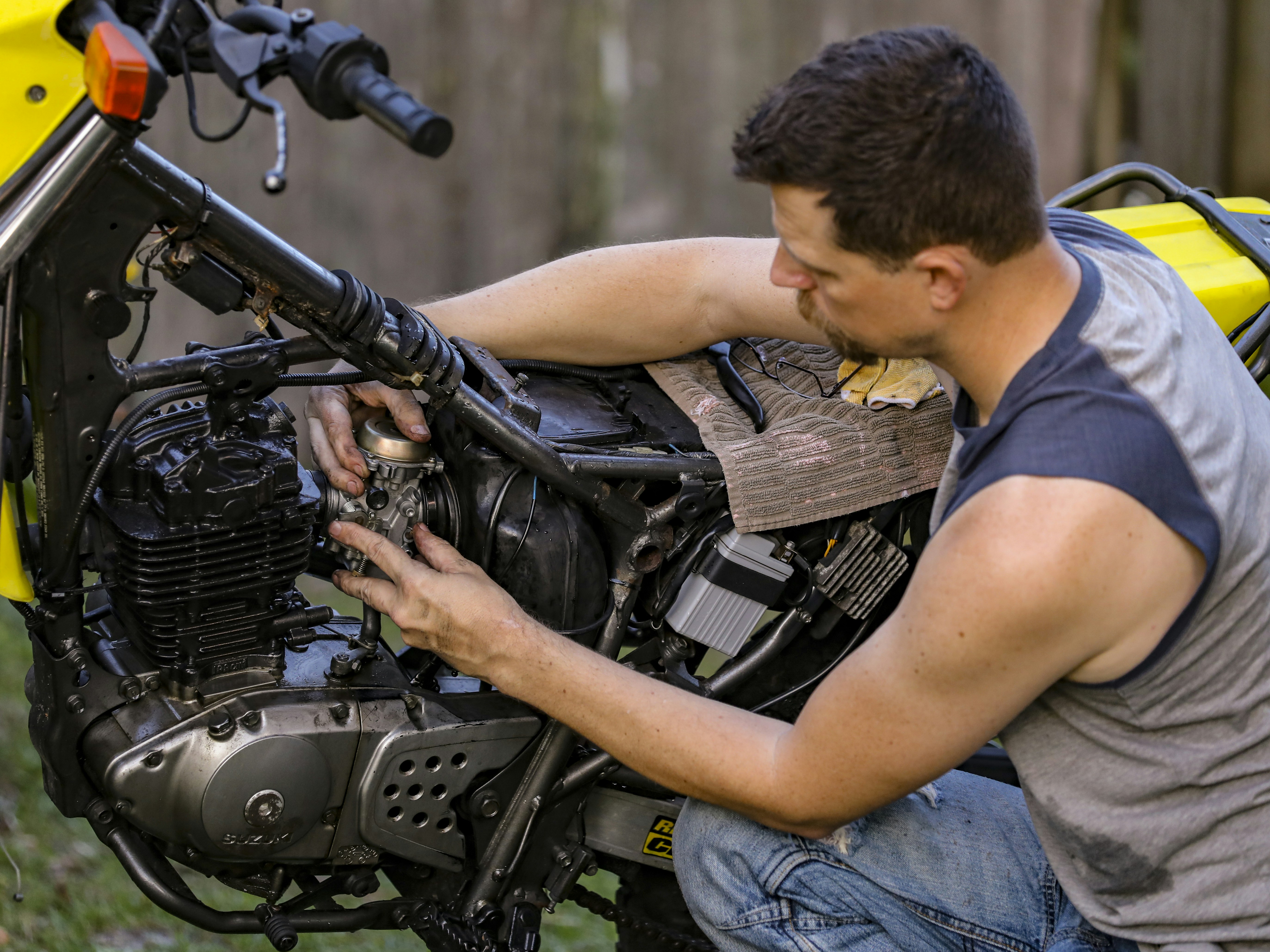 a man fixing a car engine