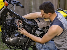 a man fixing a car engine