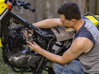 a man fixing a car engine